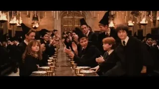 Harry Potter characters clapping at long dining table — Harry Potter and the Philosophers Stone