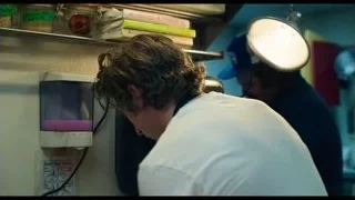 man bending over sink in kitchen — The Bear