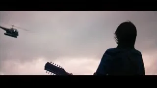 person with guitar looking at helicopter — The Secret Life of Walter Mitty