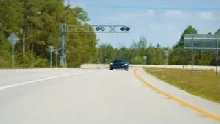 Black sports car driving on highway — Sports Cars
