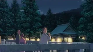 People on bridge overlooking Japanese temple — Your Name