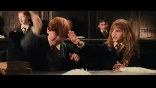 boy and girl with wand in classroom — Harry Potter and the Philosophers Stone