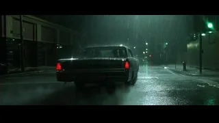 Black pickup truck driving on wet street — The Matrix