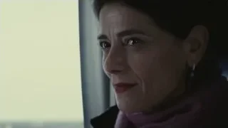 woman's face with purple scarf — Succession