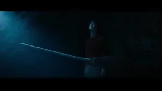 Young man holding stick in dark cave — Harry Potter and the Philosophers Stone