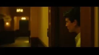 man standing deep in thought in hallway — Whiplash