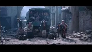 Young boy pointing in destroyed area — Iron Man