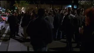 Group of people talking on street at night — Spider Man