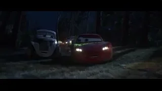 Lightning McQueen driving through dark forest at night — Cars 3