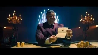 man on stage with blue lights — John Wick: Chapter 4