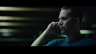 person in dark room talking on phone — Furious Seven