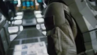 man operating spaceship control panel — Interstellar