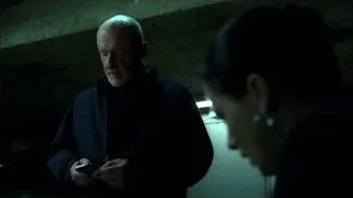 bald man looking at phone, woman watching — Breaking Bad