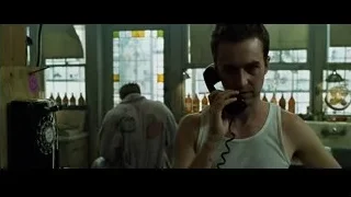 man holding telephone in dimly lit room — Fight Club