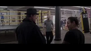 Men in boxing ring with black jacket — Creed