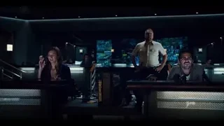 Three people in dimly lit control room — Jurassic World