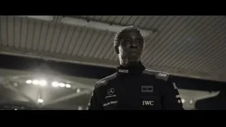 man looking up in large indoor space — F1