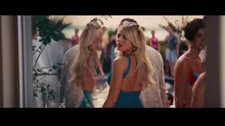 Group gathered around outdoor waterfall — The Wolf Of Wall Street