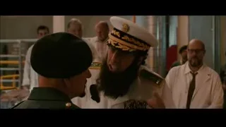 Man in military uniform conversing with another man — The Dictator