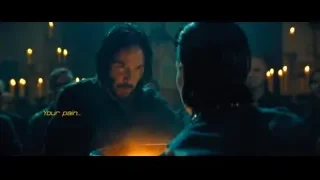 man and woman at table with candles — John Wick: Chapter 4