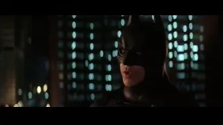 Batman standing before night cityscape — Batman