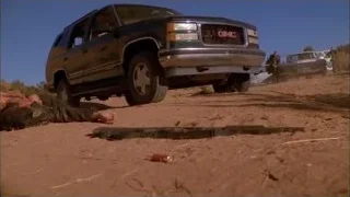 Men with rifles by GMC truck — Breaking Bad