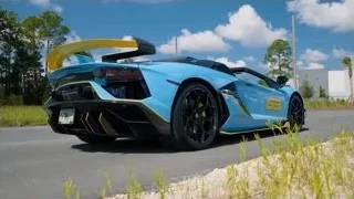 blue and yellow Lamborghini parked on road — Sports Cars