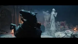 Boy with sword looking at dragon statue — Harry Potter and the Philosophers Stone