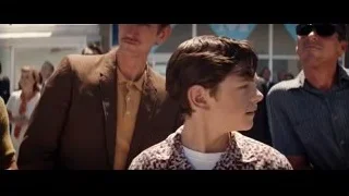 Young boy and men in front of building — Ford v Ferrari