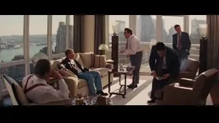 Group of men in living room, one on couch — The Wolf Of Wall Street