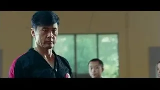 man in karate uniform martial arts stance — The Karate Kid