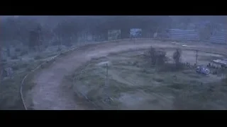 aerial view of dirt track in forest — Cars 3