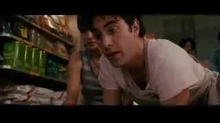 young man leaning over store counter — The Dictator