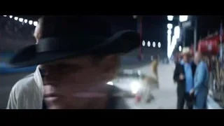 two men on a race track at night — Ford v Ferrari