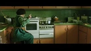 woman sitting on stool in kitchen — The Matrix