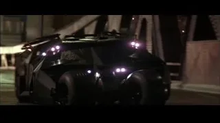 Police officer and man in front of car at night — Batman