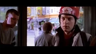 young man in red helmet on busy street — Spider Man 2
