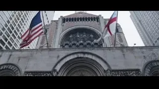 People walking up steps of ornate building — The Big Short