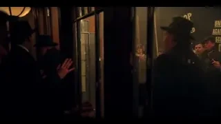 man speaking in front of OSWOLD MONEY screen — Peaky Blinders