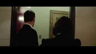man and woman walking in red hallway — Steve Jobs