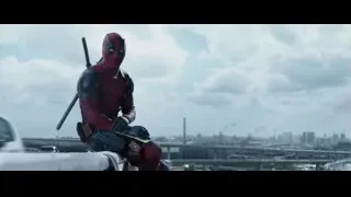 Deadpool on rooftop overlooking city — Deadpool
