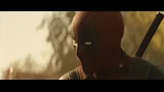 Deadpool holding sword in forested area — Deadpool 2
