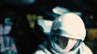person in white helmet in dark room — Interstellar
