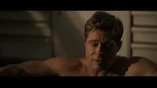 shirtless man lying on bed — F1