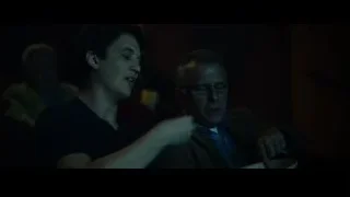 Two men sitting with eyes closed in dark room — Whiplash