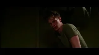 injured man with bloody face in dark room — Hacksaw Ridge