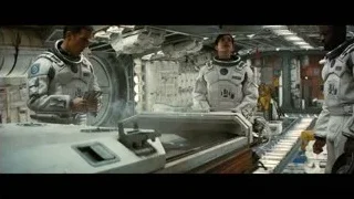 Astronauts in space station with large machine — Interstellar