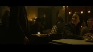 woman and people dining in dimly lit restaurant — The Social Network