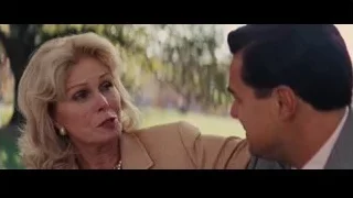 Man and woman conversing in park — The Wolf Of Wall Street