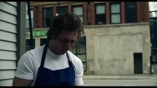 man in apron on street with eyes closed — The Bear